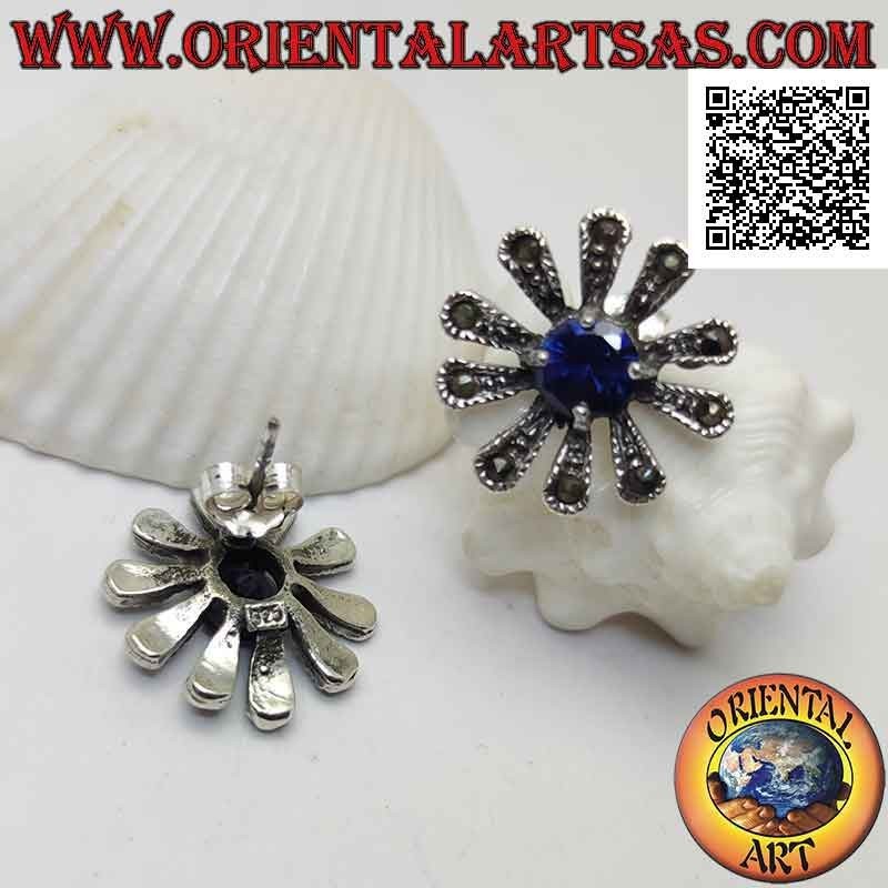 Silver earrings with large daisy lobe studded with marcasite and central round synthetic sapphire