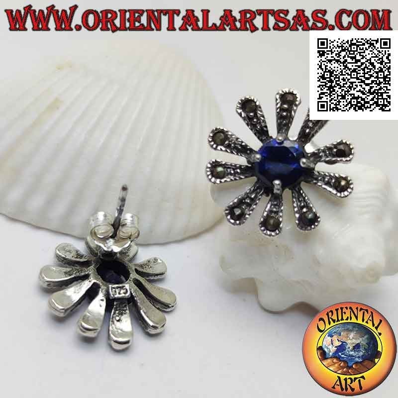 Silver earrings with large daisy lobe studded with marcasite and central round synthetic sapphire