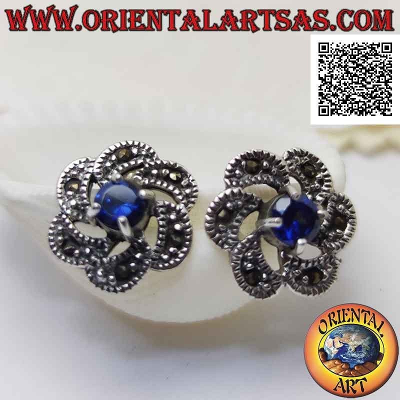 Silver lobe earrings with round synthetic sapphire in the center of a concentric and marcasite movement