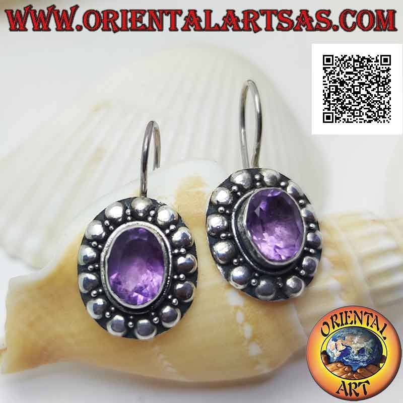 Silver leverback earrings with faceted oval amethyst surrounded by interweaving and studs