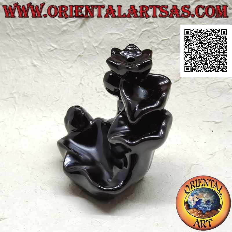 Cone shaped incense burner in the shape of a fountain of leaves for cascading smoke effect, in ceramic