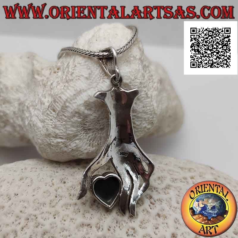 Silver pendant, onyx heart between the fingers of a hand studded with marcasite