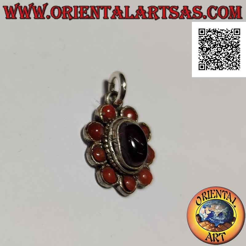 Silver flower pendant with central cabochon oval garnet surrounded by corals