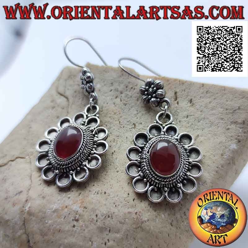 Hook silver earrings with cabochon oval carnelian surrounded by bas-relief circles