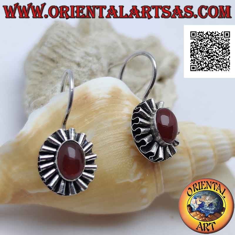 Silver earrings with oval cabochon carnelian surrounded by undulated silver ribbon