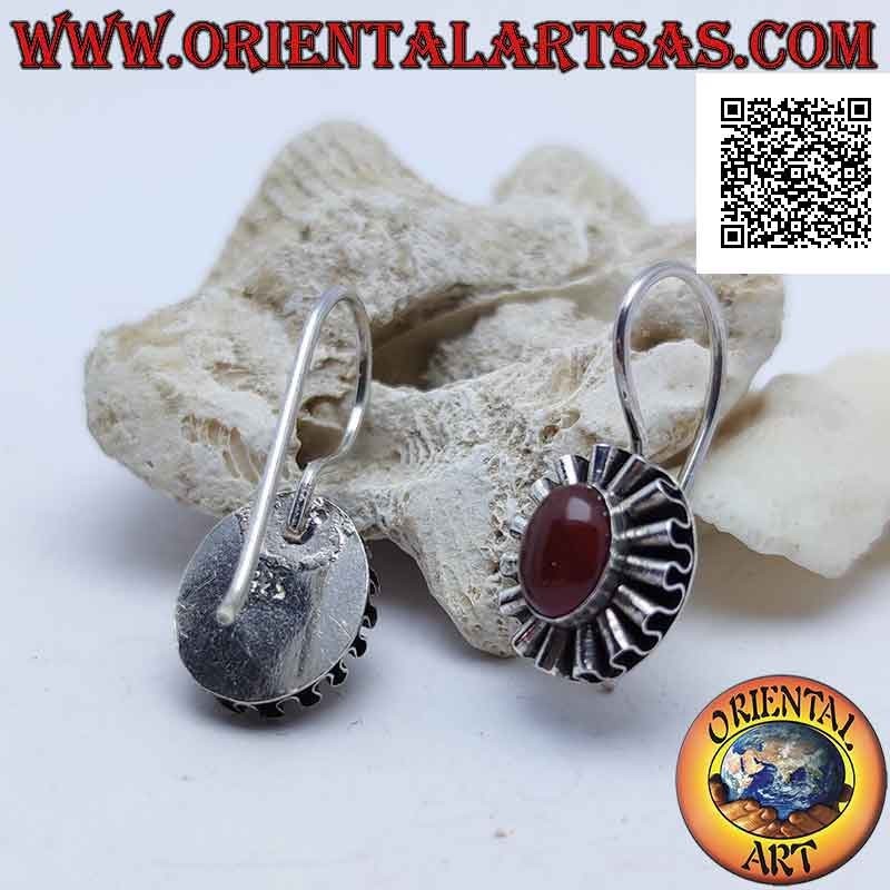 Silver earrings with oval cabochon carnelian surrounded by undulated silver ribbon