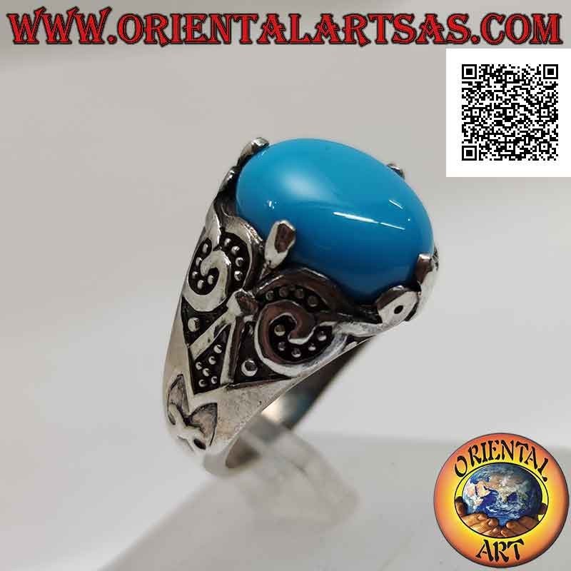 Silver ring with oval cabochon turquoise set at 4 with lily decoration on the sides