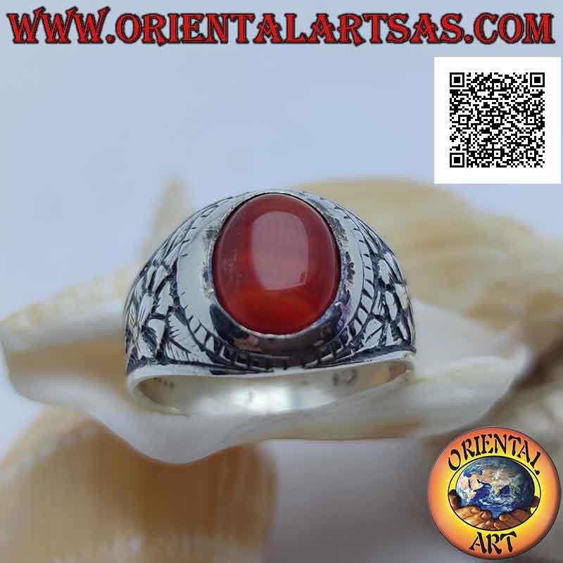 Silver ring with cabochon oval carnelian and rebirth flower in bas-relief on the sides