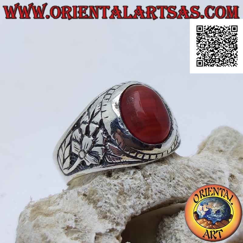 Silver ring with cabochon oval carnelian and rebirth flower in bas-relief on the sides