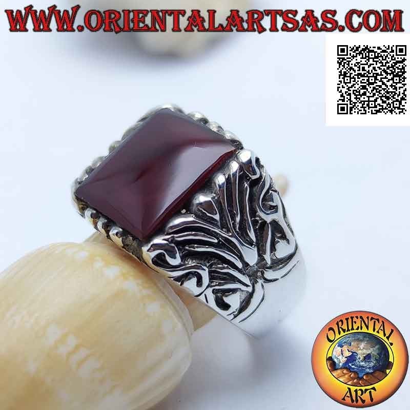 Silver ring with square carnelian surrounded by baroque engravings on an imposing setting