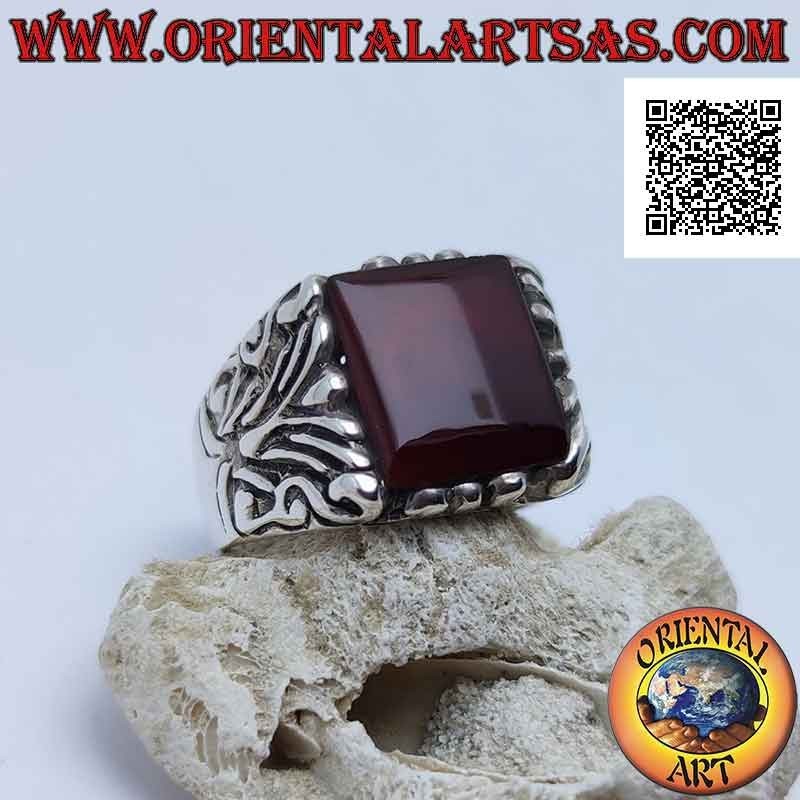 Silver ring with square carnelian surrounded by baroque engravings on an imposing setting