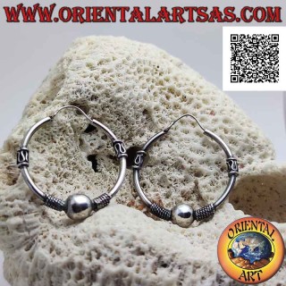 Silver earring, circle worked with a ball between intertwining and serpentine on the sides, 32 mm