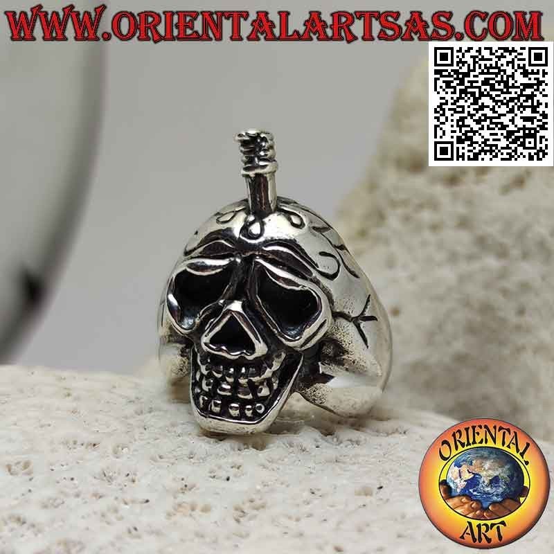 Silver ring in the shape of a suffering skull with a sword stuck in the skull