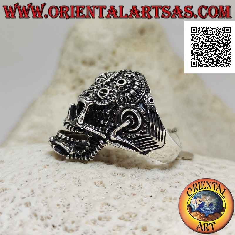 Silver ring in the shape of a satanic skull worked with gears and pentacle engraved on the forehead