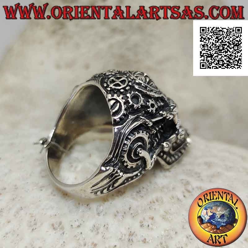 Silver ring in the shape of a satanic skull worked with gears and pentacle engraved on the forehead