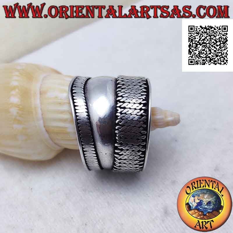 Wide band silver ring with a point and vertical interlacing on one side, Bali