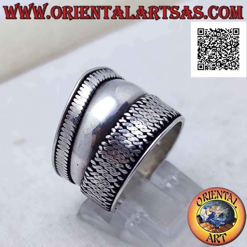 Wide band silver ring with a point and vertical interlacing on one side, Bali