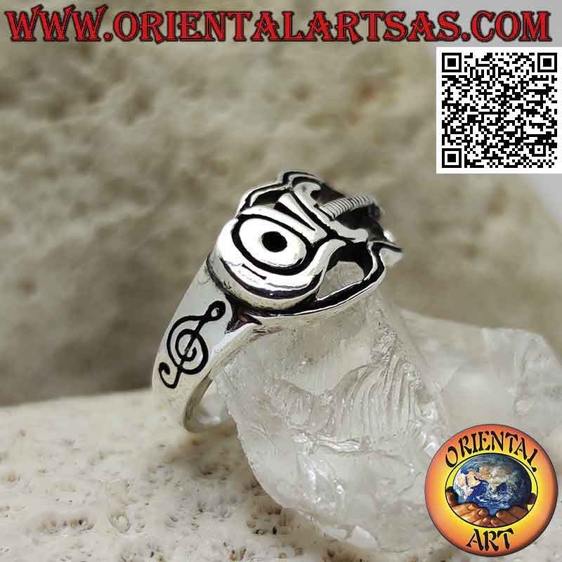 Silver ring in the shape of an electric guitar with "Love" writing