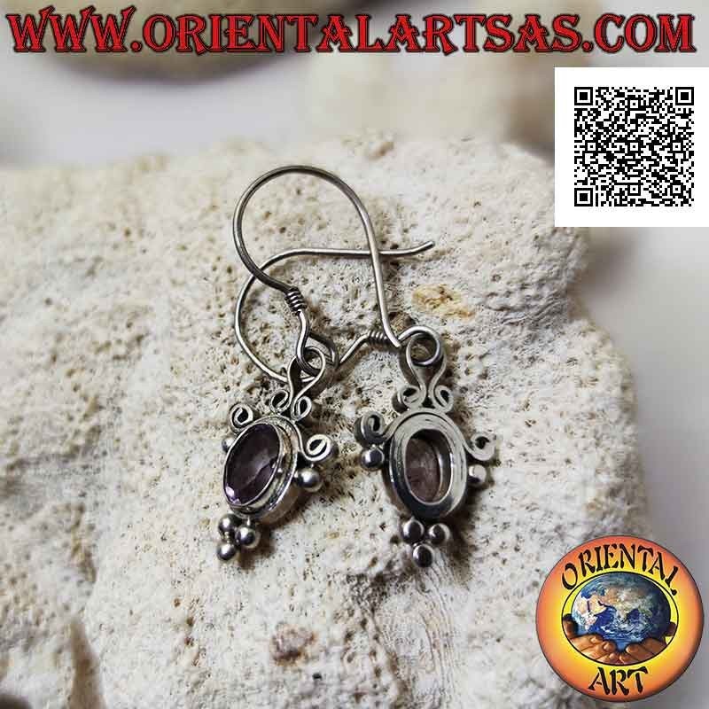 Silver leverback earrings with faceted oval amethyst surrounded by curved lines and balls