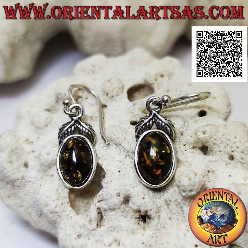 Silver pendant earrings with oval green amber surrounded by a smooth edge and a pair of leaves above
