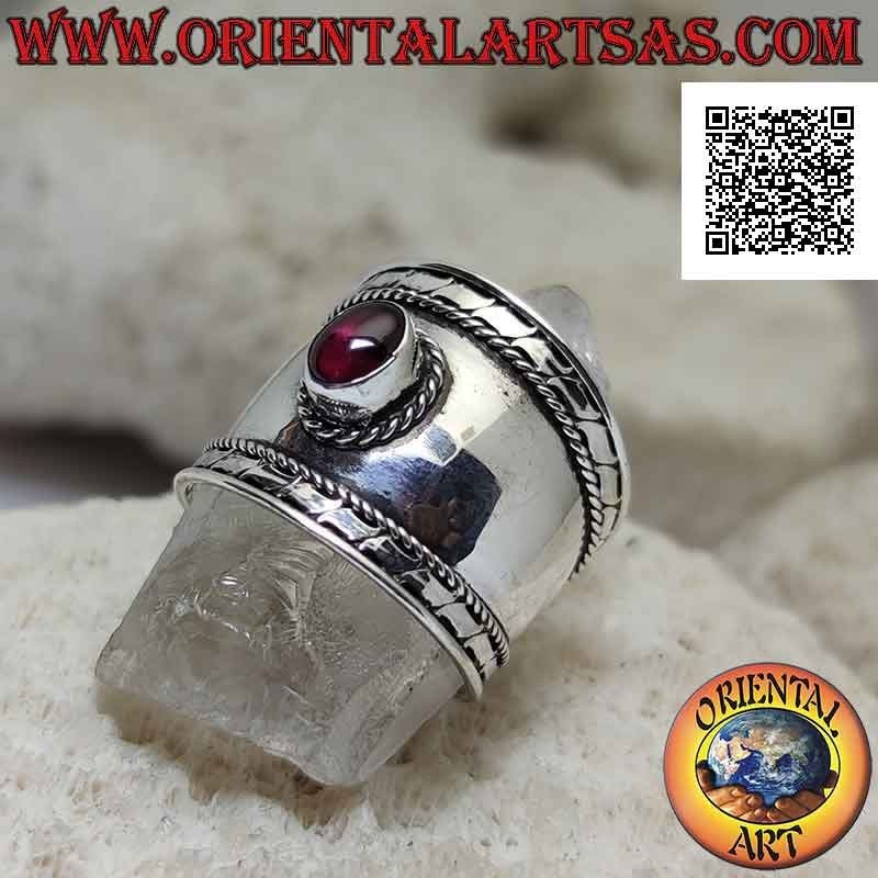 Wide band silver ring with oval garnet and intertwining and stripes on the sides, Bali