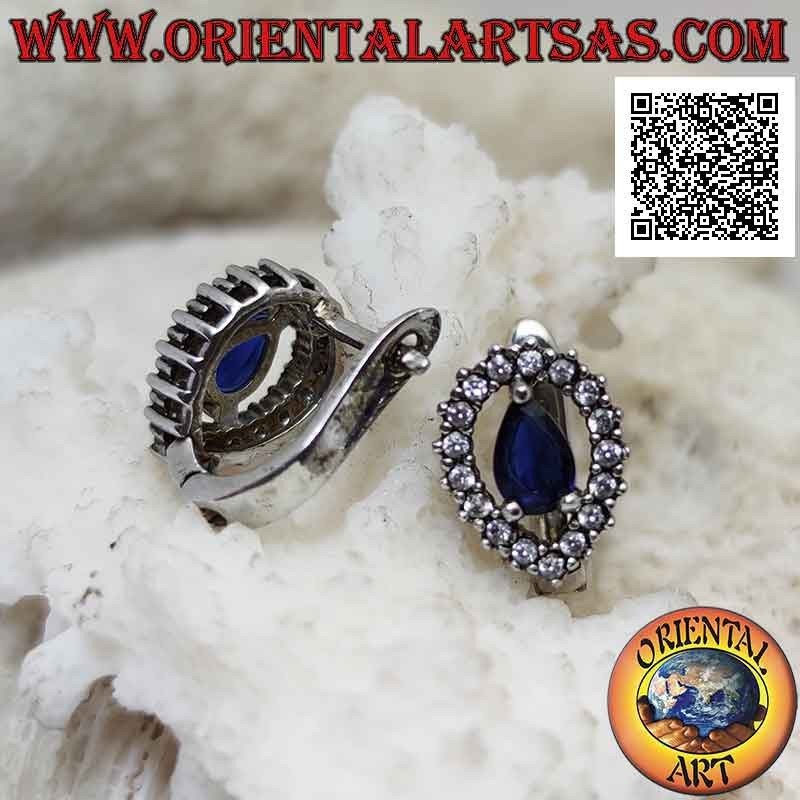 Silver earrings with synthetic teardrop sapphire surrounded by an inverted drop of white zircons