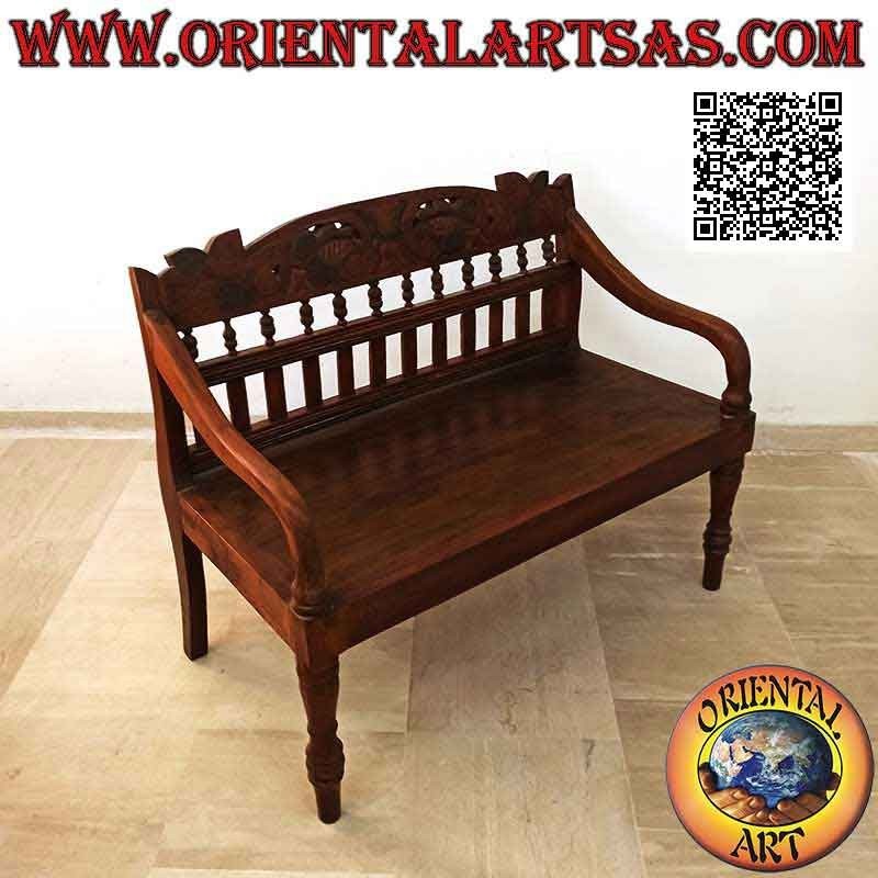 Antique colonial bench with hand-carved floral decoration in teak wood