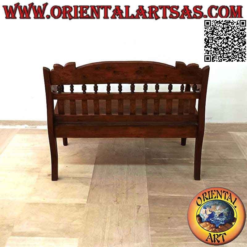 Antique colonial bench with hand-carved floral decoration in teak wood