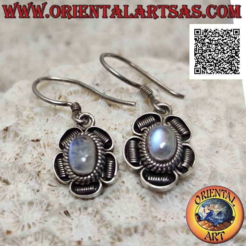 Silver flower earrings with cabochon oval rainbow moonstone and bas-relief decoration