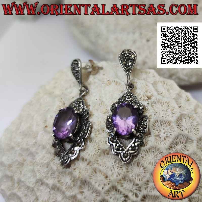 Silver earrings with faceted natural amethyst set protruding on a frame studded with marcasite