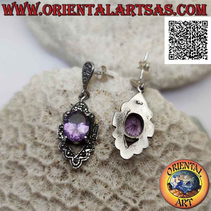 Silver earrings with faceted natural amethyst set protruding on a frame studded with marcasite