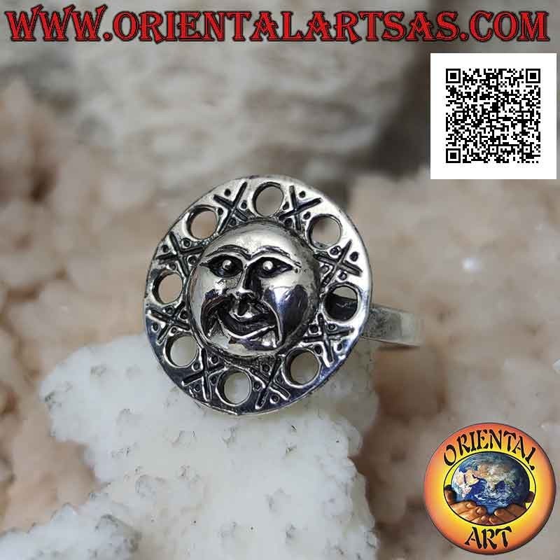 Round silver ring with a shaped face of the sun and perforated circles around it