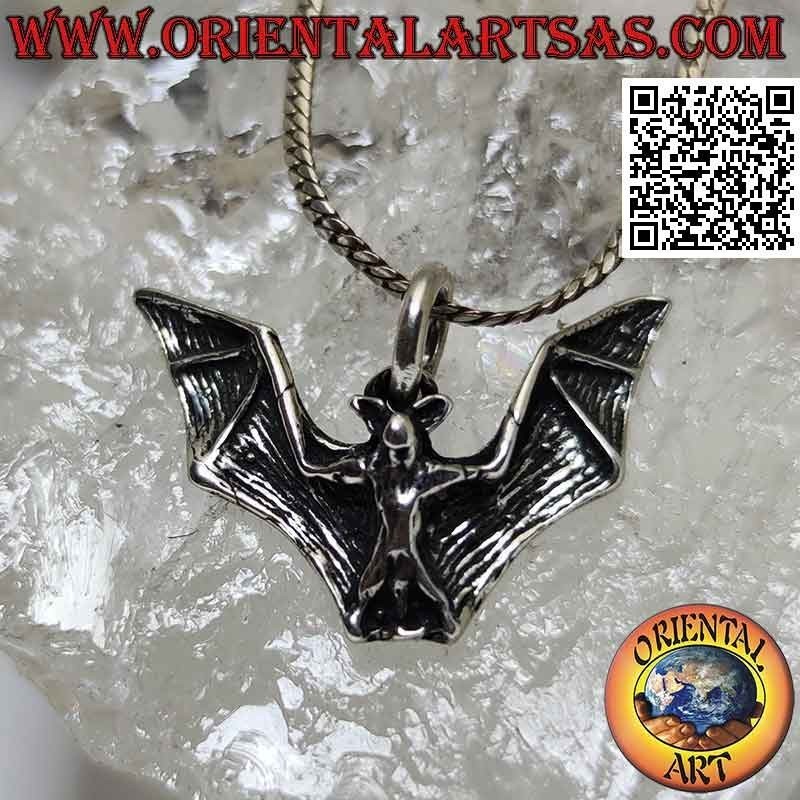 Silver pendant in the shape of a bat with large spread wings