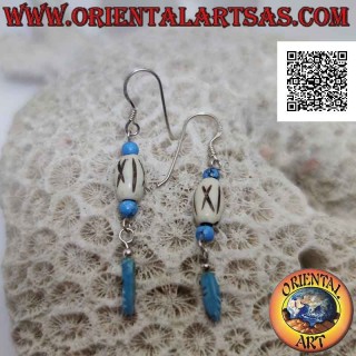 Silver earrings with a white cylinder between turquoise beads and a pendant turquoise feather