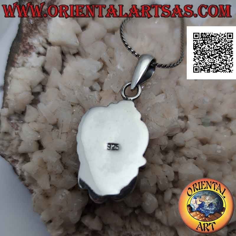 Colgante de plata con gran cabujón ovalado en pasta turquesa y flor con hoja en la parte superior