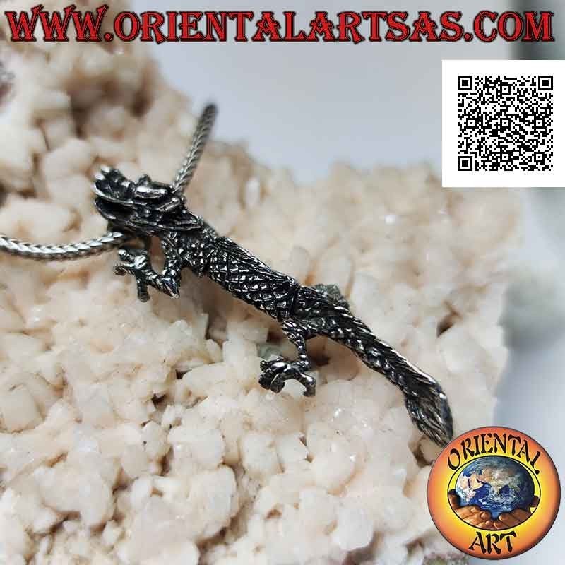 Silver pendant in the shape of an oriental (Chinese) dragon in three-dimensional movable integral