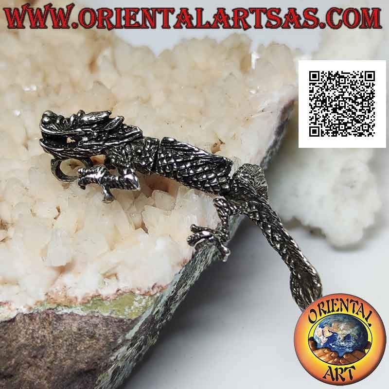 Silver pendant in the shape of an oriental (Chinese) dragon in three-dimensional movable integral