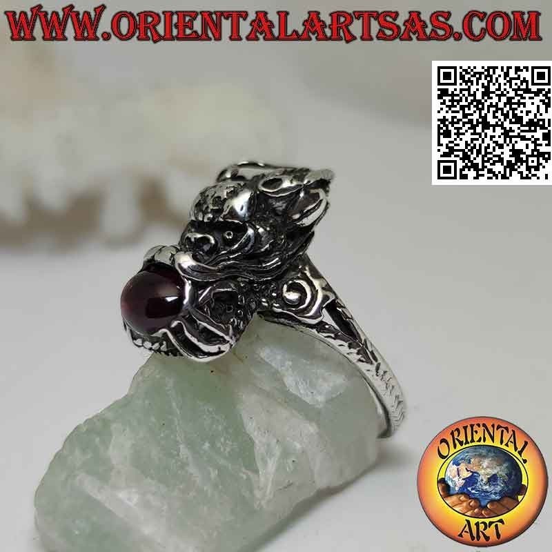 Nepalese dragon-shaped silver ring with natural oval garnet in the mouth