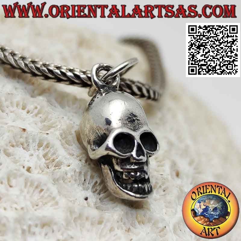 Silver pendant in the shape of a three-dimensional skull with wide open eyes (small)