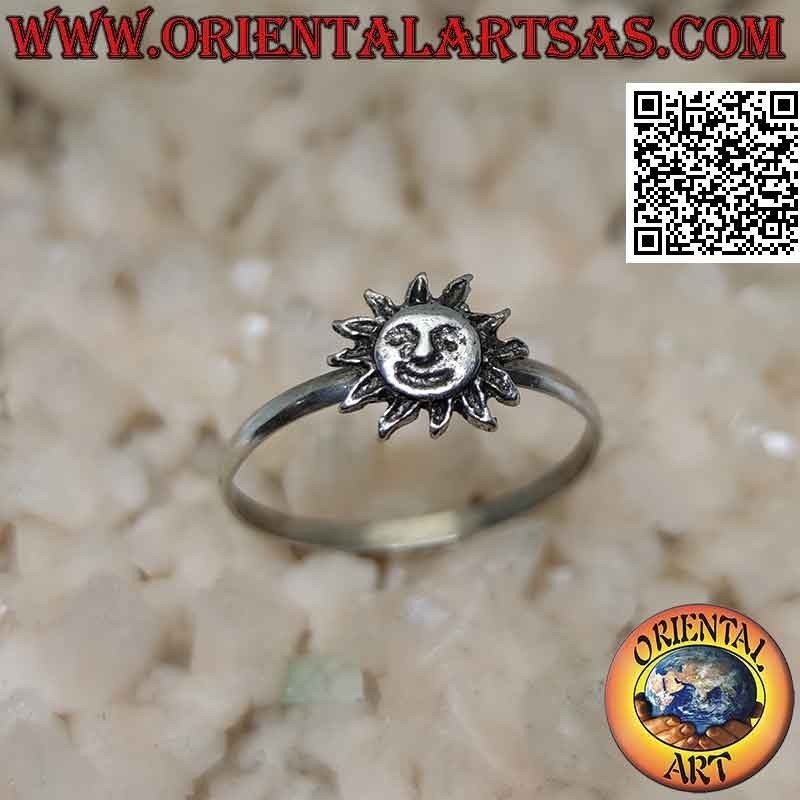 Silver ring with a small sun with a shaped face