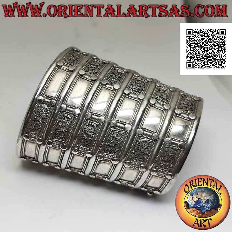 Wide rigid bracelet in 925 ‰ silver "alla schiava" with relief decorations (8.7 cm)