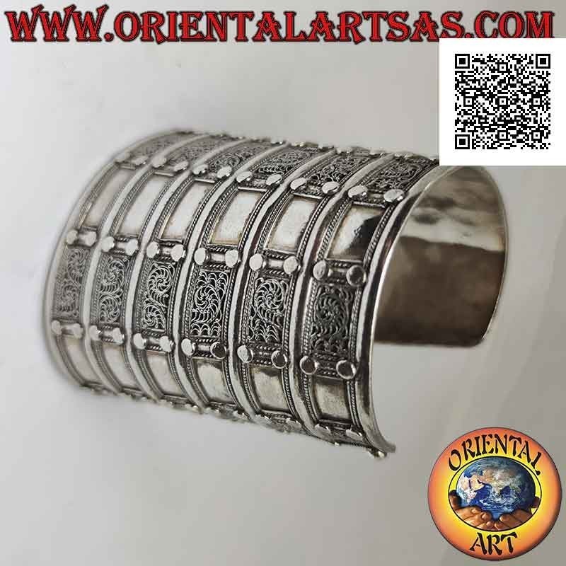Wide rigid bracelet in 925 ‰ silver "alla schiava" with relief decorations (8.7 cm)