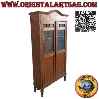 Antique showcase with two doors with colored glass in teak wood