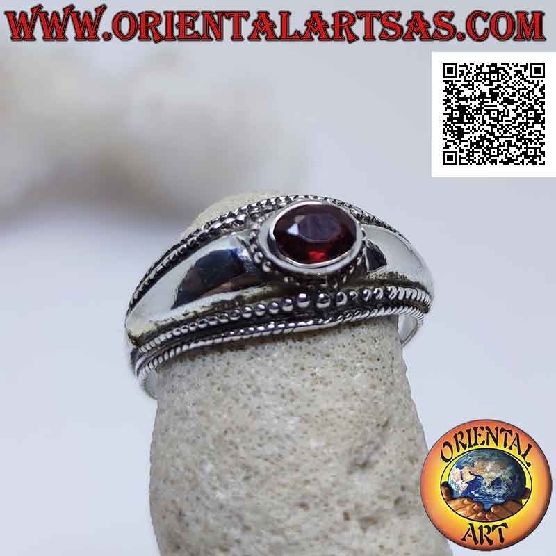 Silver ring with horizontal oval garnet and balls decoration