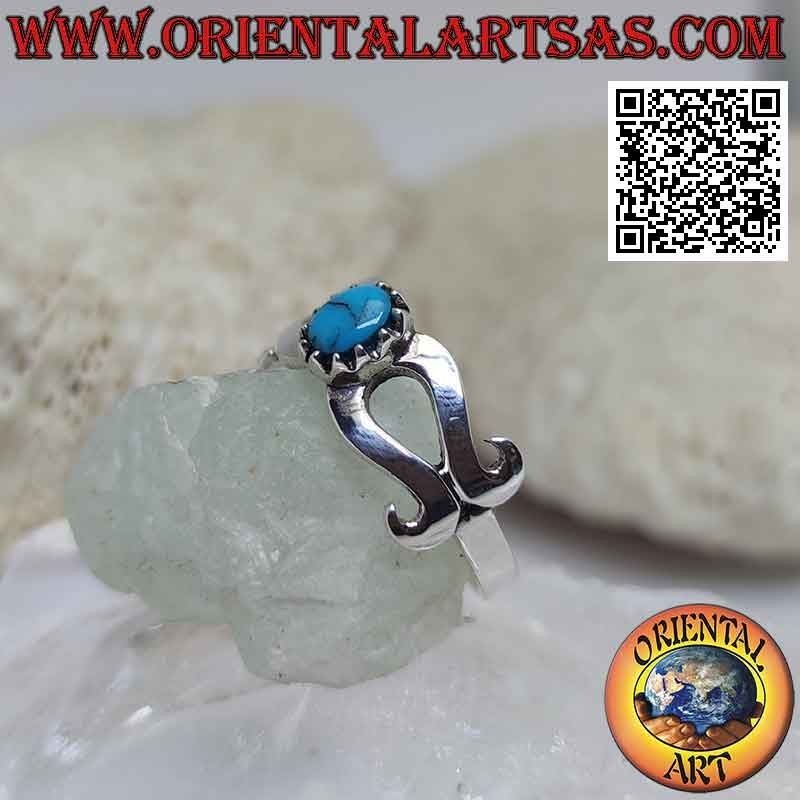 Bague en argent avec turquoise sertie au centre d'un infini lisse