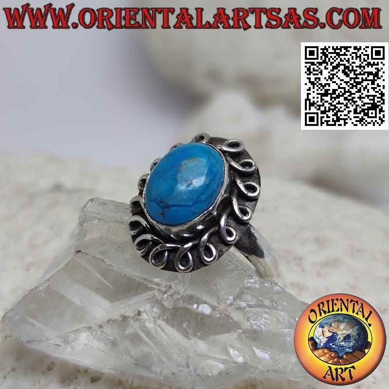Silver ring with cabochon oval turquoise surrounded by a rolled line