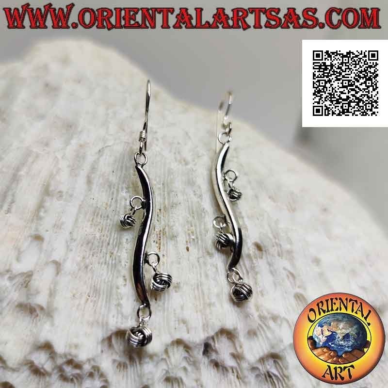 Silver earrings with wavy line hooks with dangling balls of intertwining