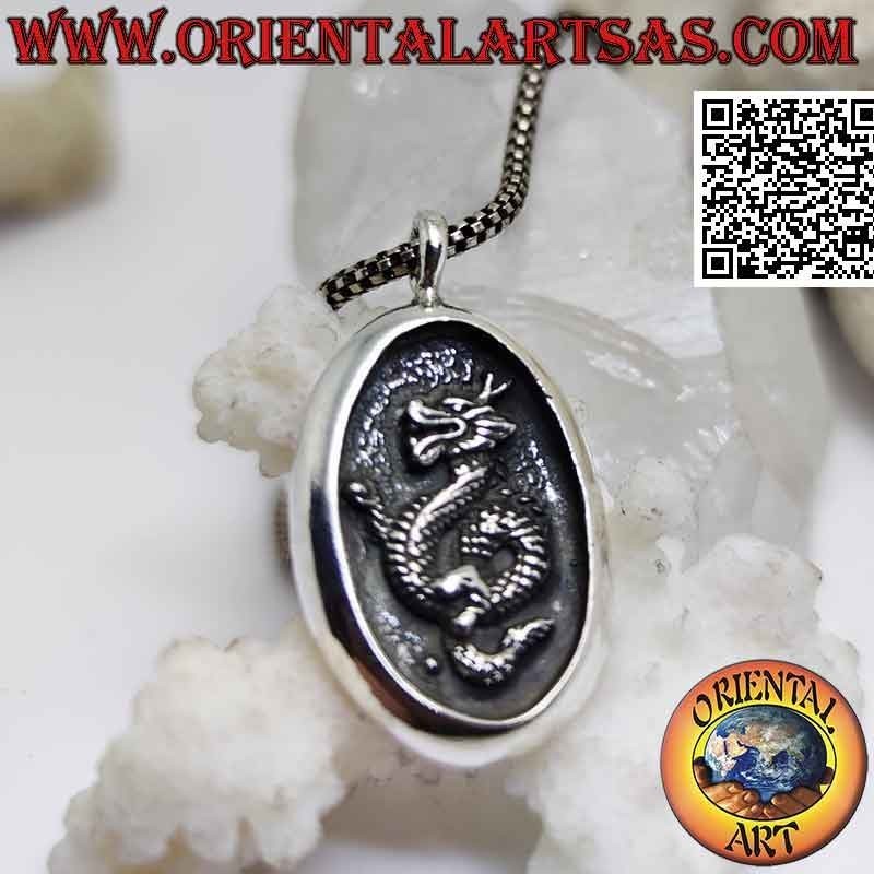 Silver pendant, oval medal with Nepalese dragon in bas-relief