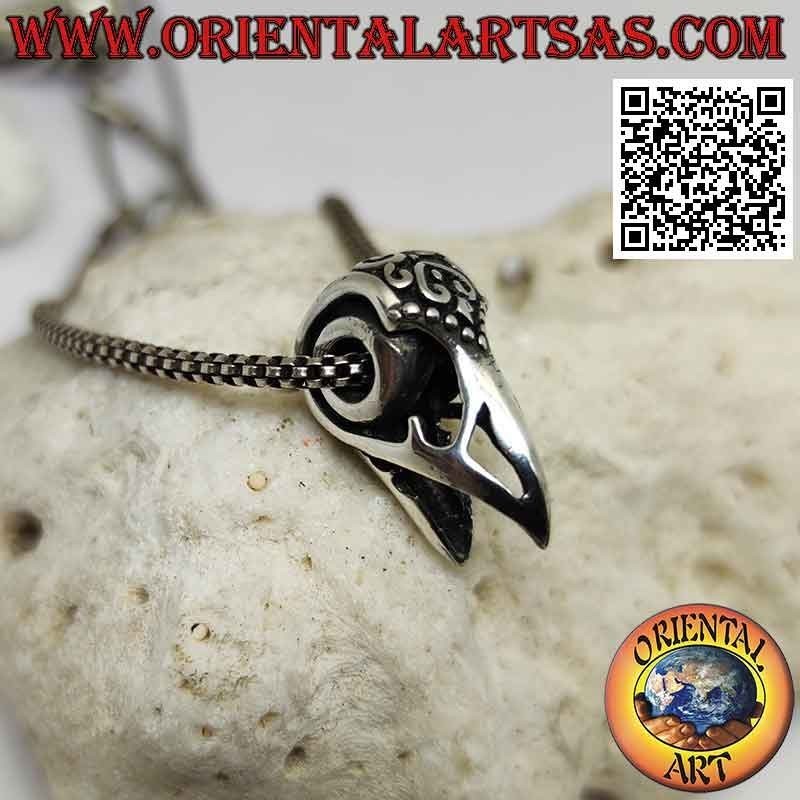 Silver pendant, the raptor's beak (decorated and pierced)