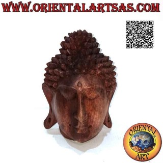 Three-dimensional Buddha head sculpture carved from a single 16 cm block of suar wood